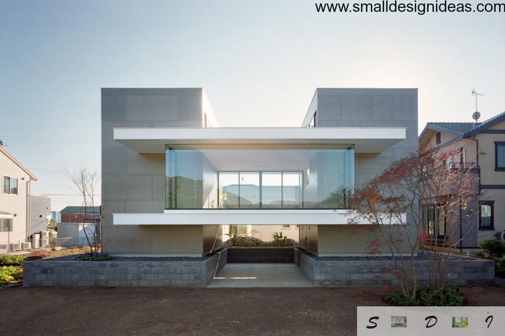 Unique stunning house facade in minimalistic style with a lot of glass