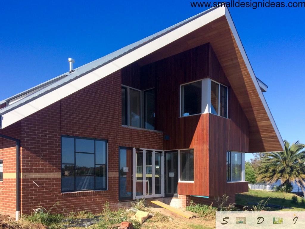 German style angle roof and red bricks facade design of the house