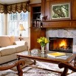 House living room with fireplace and wooden carved furniture