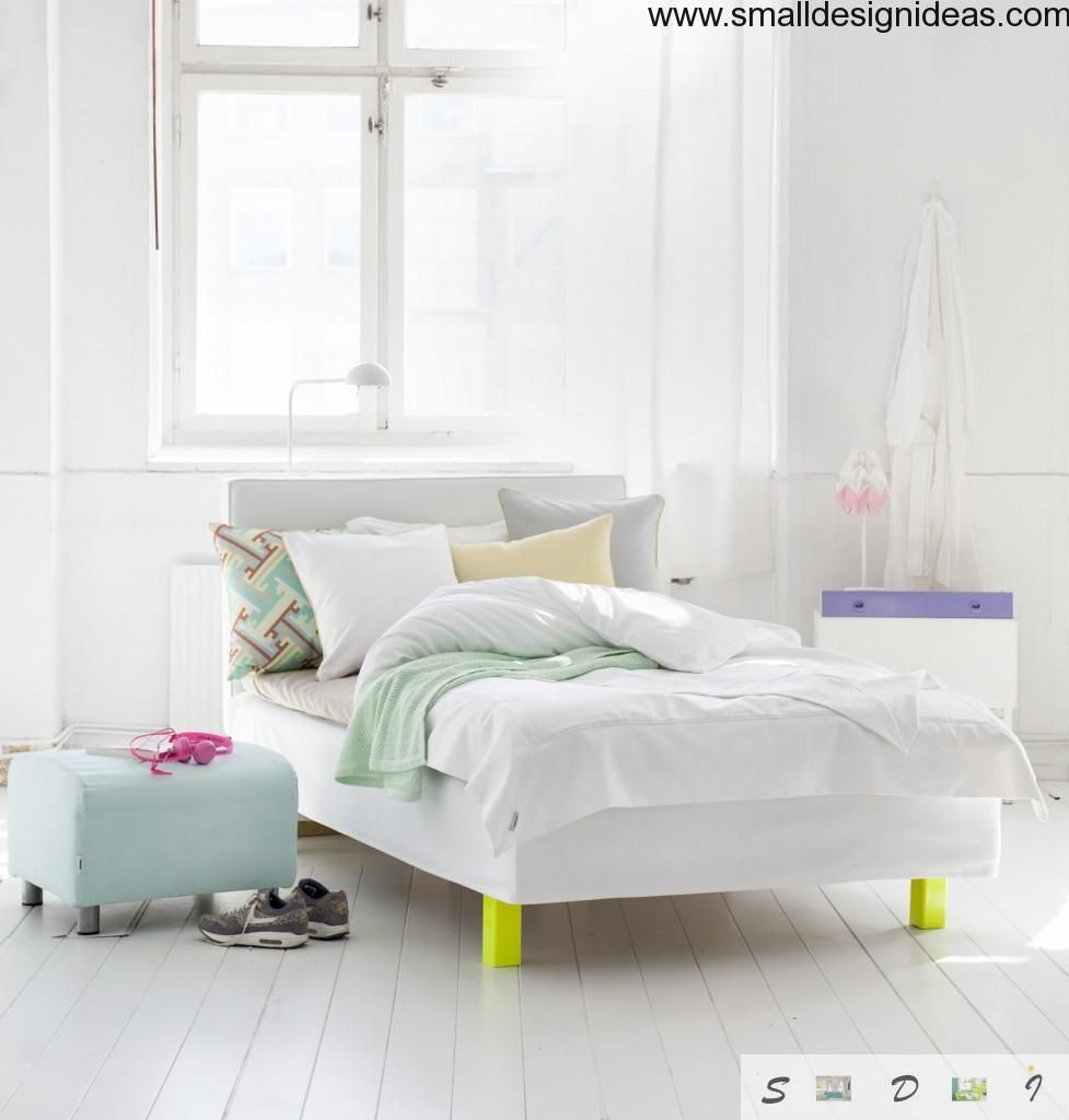 Unusual wooden furniture and bright textile in the bedroom - is the specific feature of the Scandinavian style