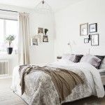 Bedroom with white tones of upholstery and textiles