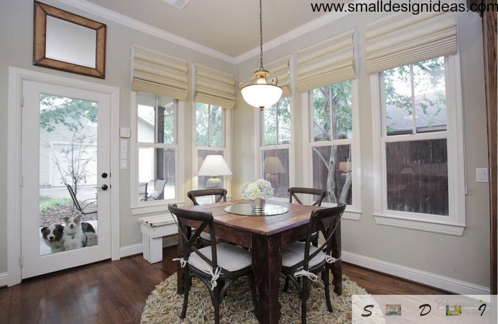 Wooden furniture in the wide windowed dining room