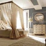 Curtains around the bedding in the classic stylized bedroom