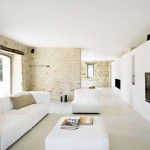 Semi-rustic minimalist style design in the interior of this gorgeous living room with white cozy furniture