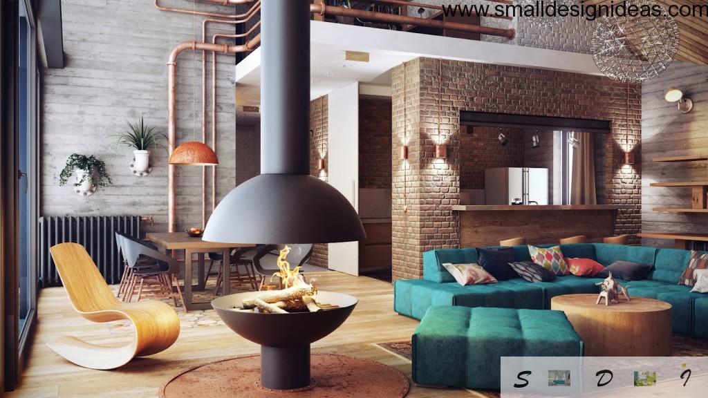 Loft interior of the living room with original safe fireplace and turquoise furniture