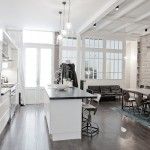 Redesigned apartment with a large Loft island kitchen in a sterile light colors