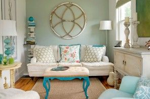 Positive and pleasant interior of the vintage small living room with coffe table and sofa with pillows