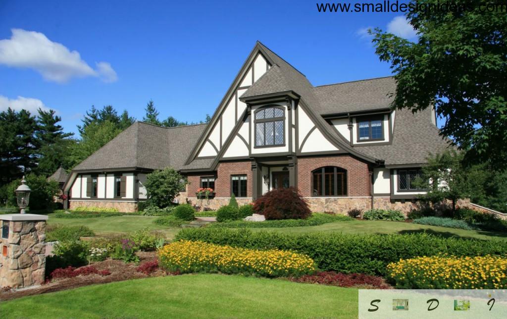 Nice Tudor style house with house adjoining flower beds, rigor design and wide windows