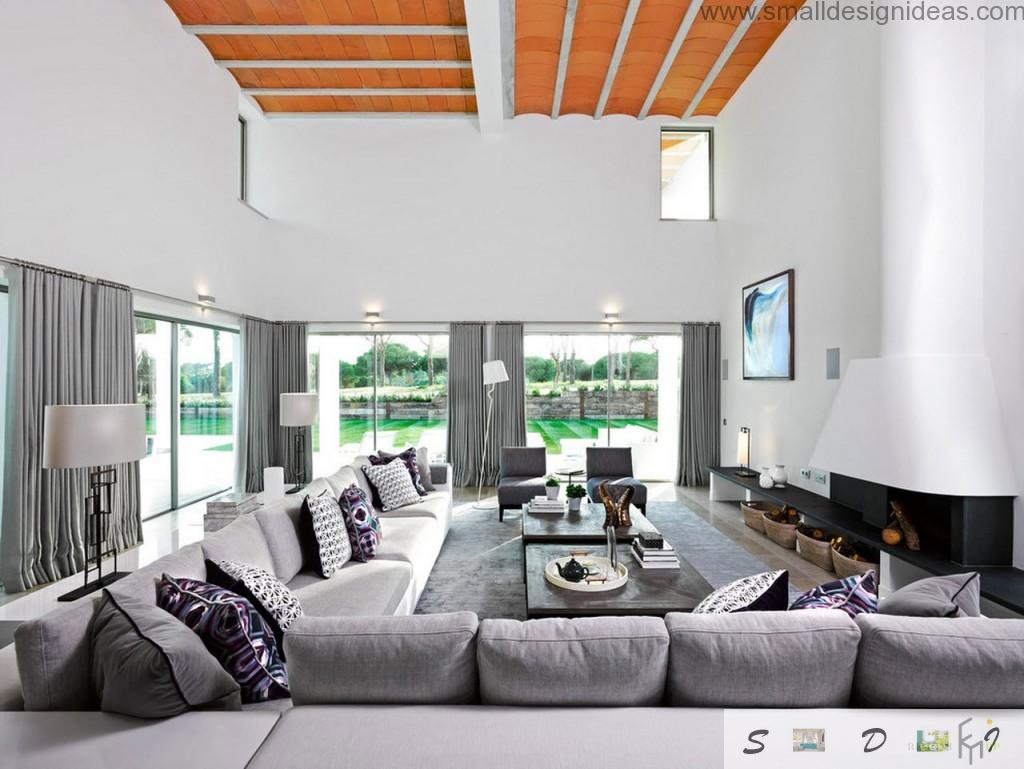 Decorative interesting cross bars at the ceiling of the spacious light living room full of furniture and silver furniture