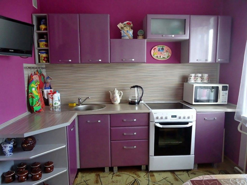 Nice purple design experiment in the small kitchen with contrasting white oven