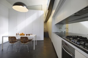 cute galley kitchen after the remodeling and wall redevelopment