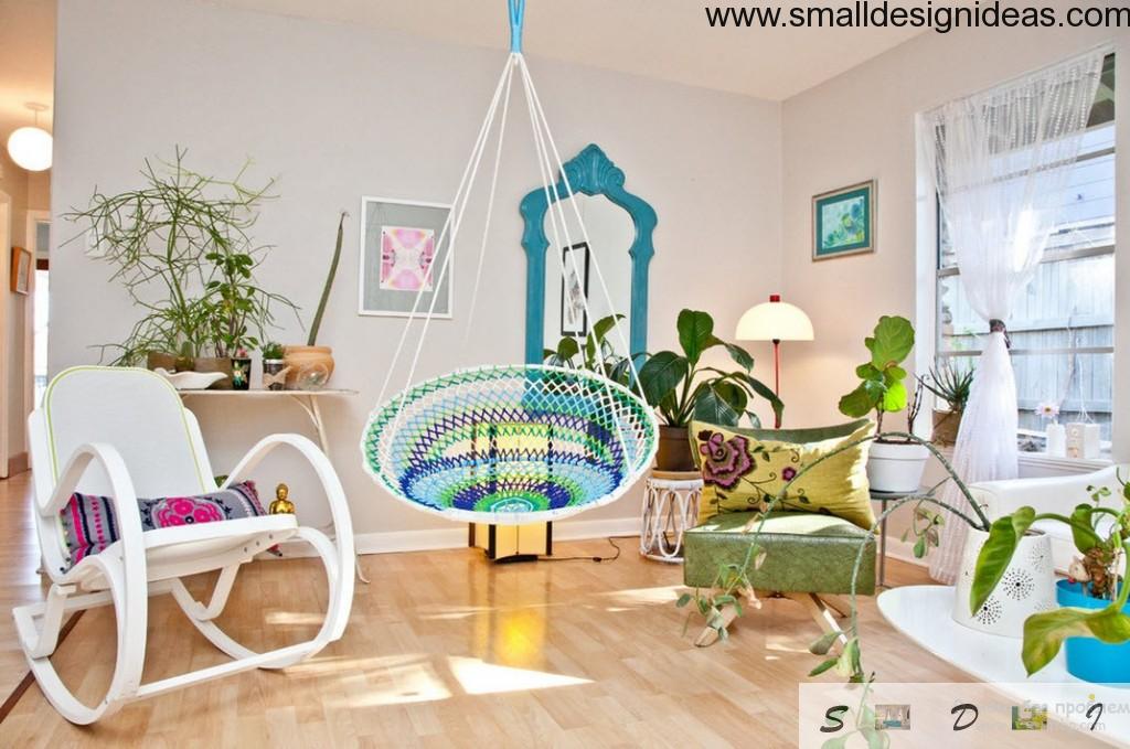 Unique design of spacious living room in eco design with textile suspended blue swing