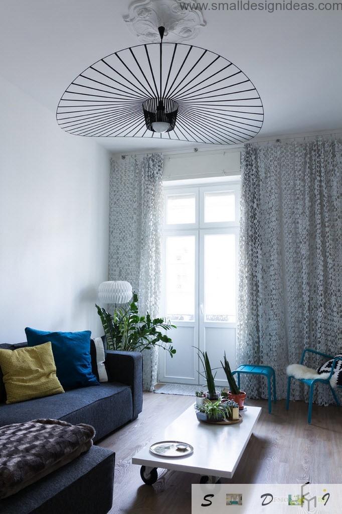 Unusual hat-chandelier in the mere progressive and stylish living room interior