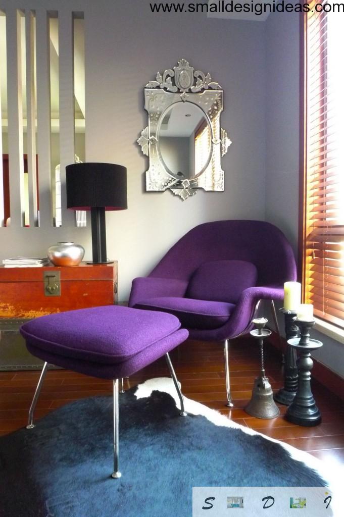 Cozy purple two bodied armchair in the eclectic interior of the living room