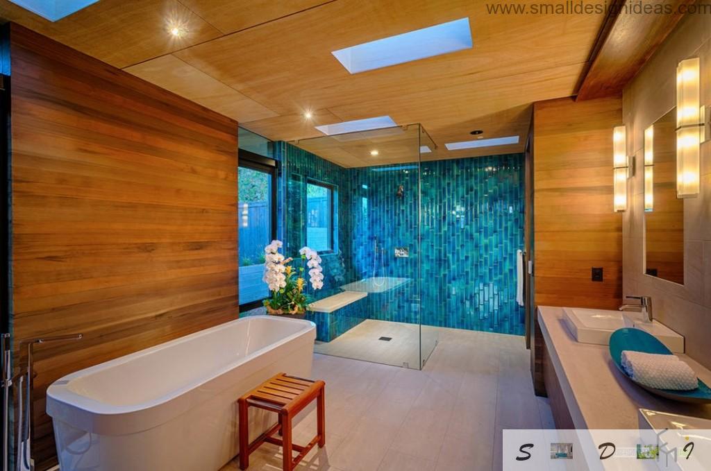 Bright contemporary bathroom interior with wooden and mosaic trim in amber and blue