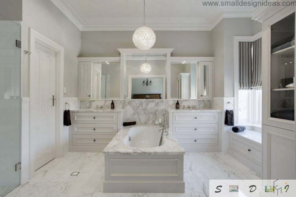 White drawers and marble bathtub in the classic interior