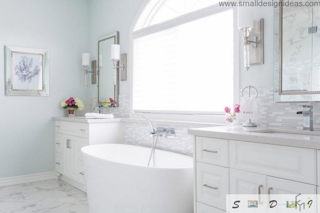 White two sink designed bathroom with unique form of bathtub and steel chrome plumbing