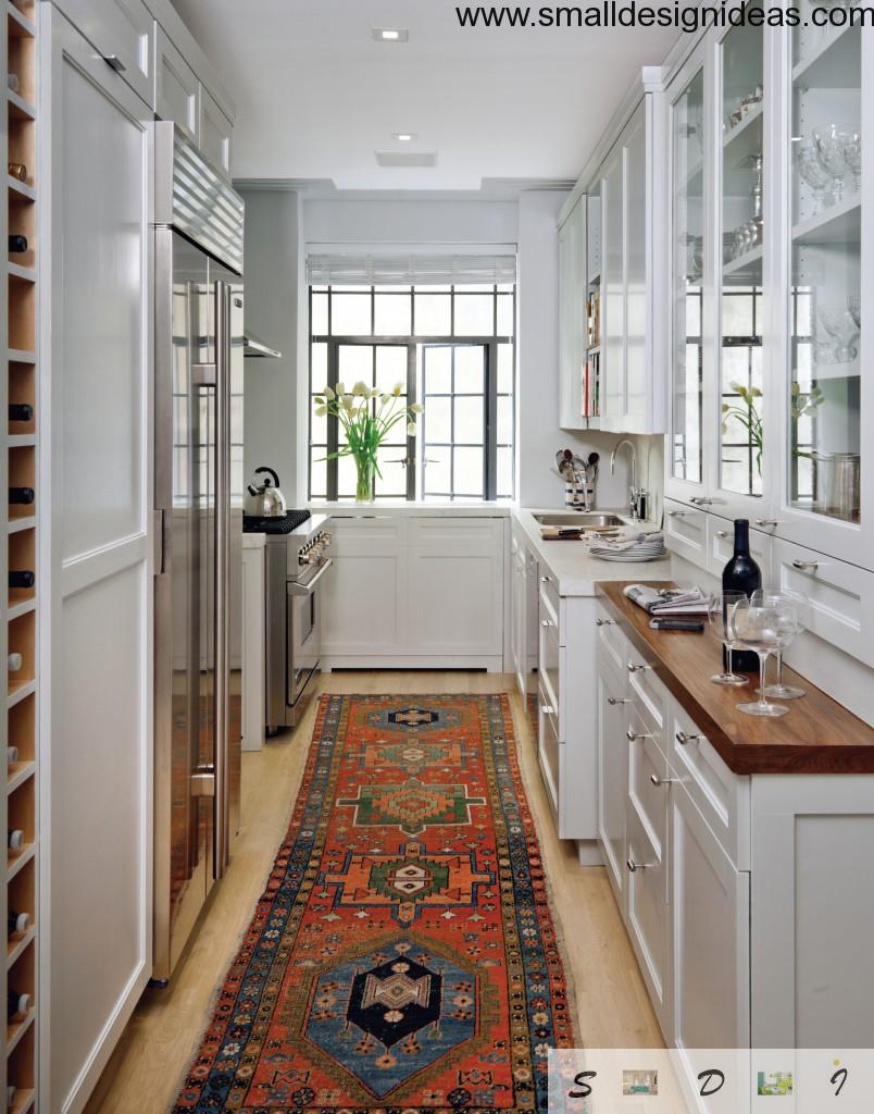 Modern galley kitchen white interior with wooden trimming of surfaces