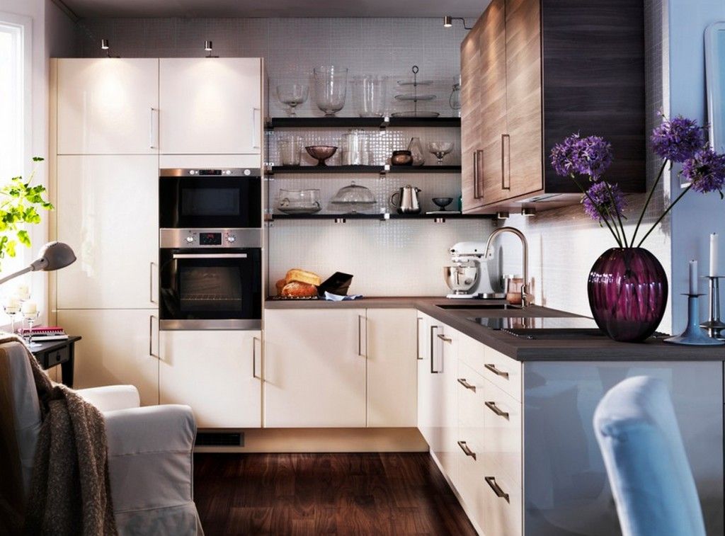 White and creamy colore kitchen design with a lot of folding drawers and cabinets, shelves and contemporary tech