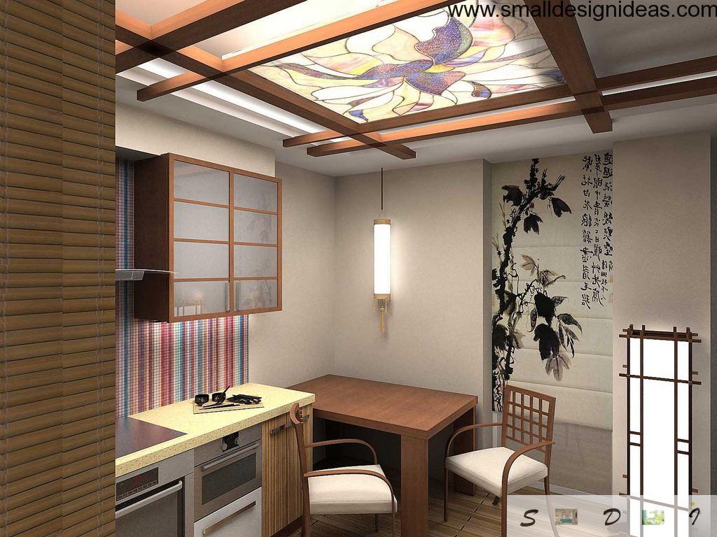 Dining zone decorated in the apparent Japanese style with floral ornamentation, paintings and wooden furniture