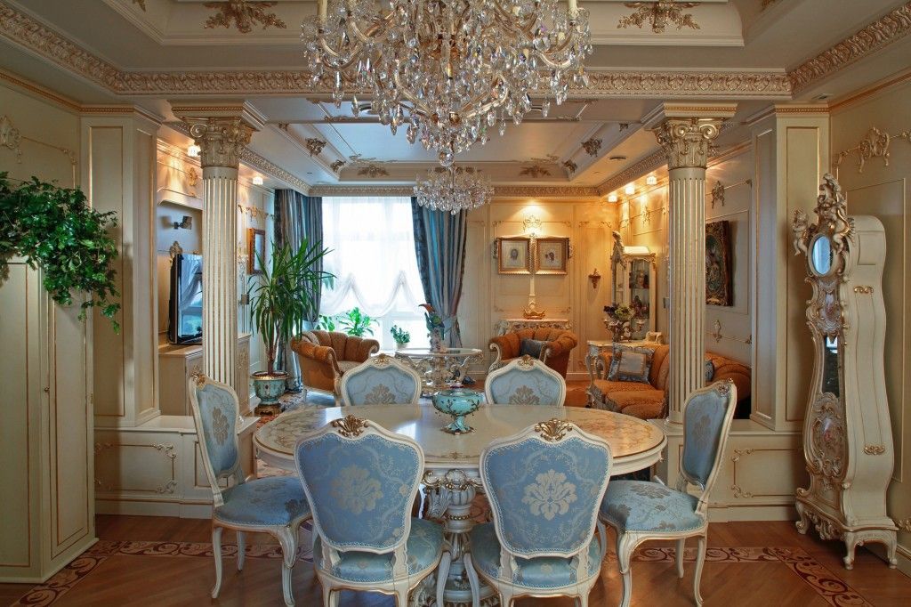 Barique dining room in the spacious suburb villa with columns and royal blue sheathing of chairs