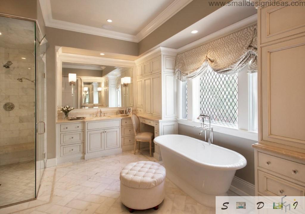 Chic and fashionable bathroom design with lambrequins and soft puff in front of oval ceramic bathtub