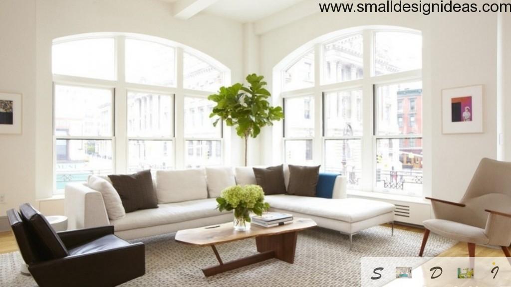 Bright joyful white room doesn`t look sterile with green additions to the interior