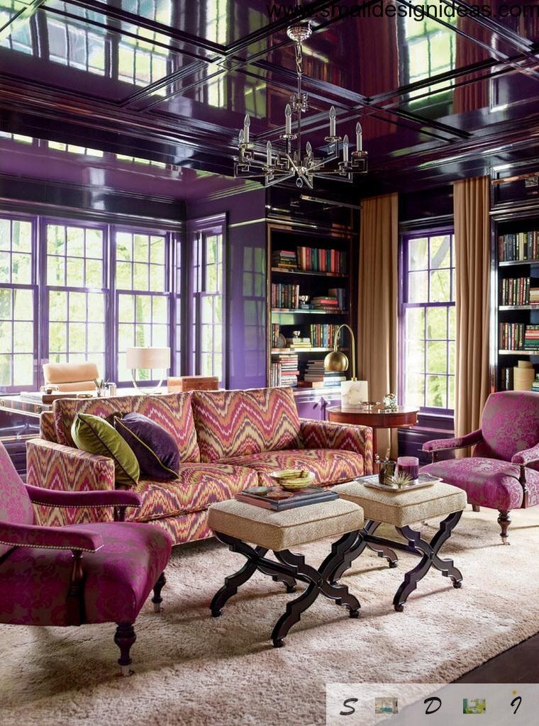 Purple eclectic design with creamy colored soft tables in front of the sofas and armchairs