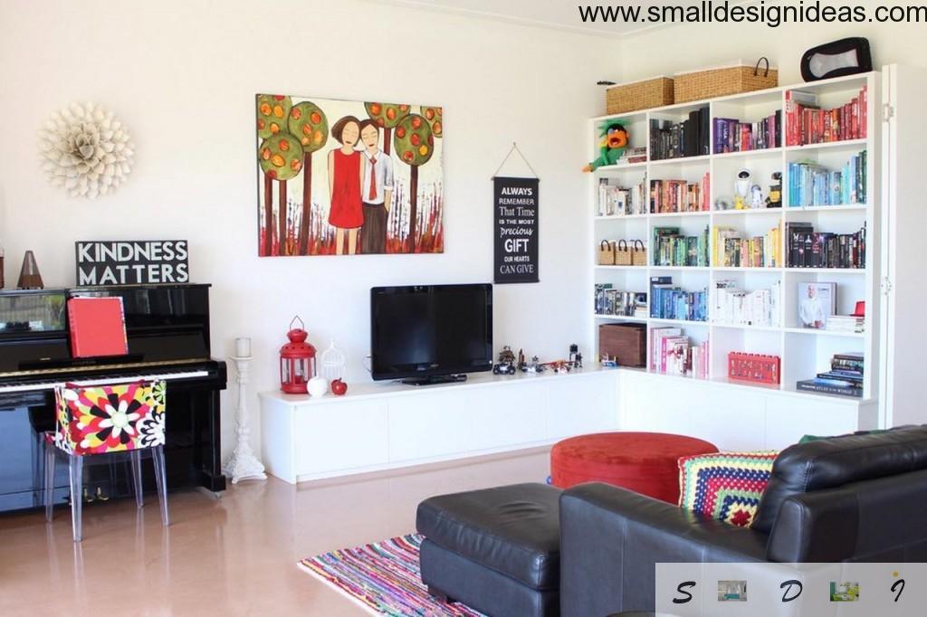 Discreet eclectic interior in the light colored living room with the picture of family on the wall