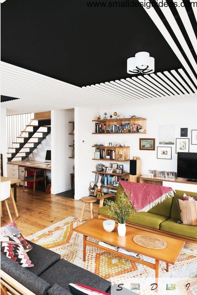 Black and white living room ceiling with contrast to the wooden floor in eclectic design