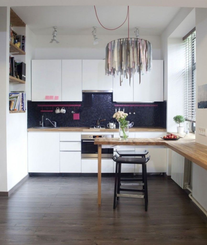 Minimalistic interior in the small kitchen with contrast and textiled unusual chandelier