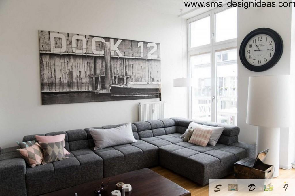 dark furniture and poster in the white eclectic living room interior