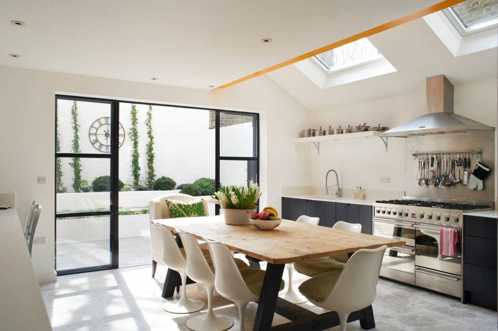 Eclectic interior of the bright light kitchen with ecological motives