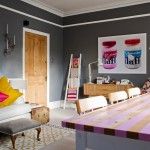 Garish colors and unexpectedly bright furniture in dull interior - it`s Kitsch