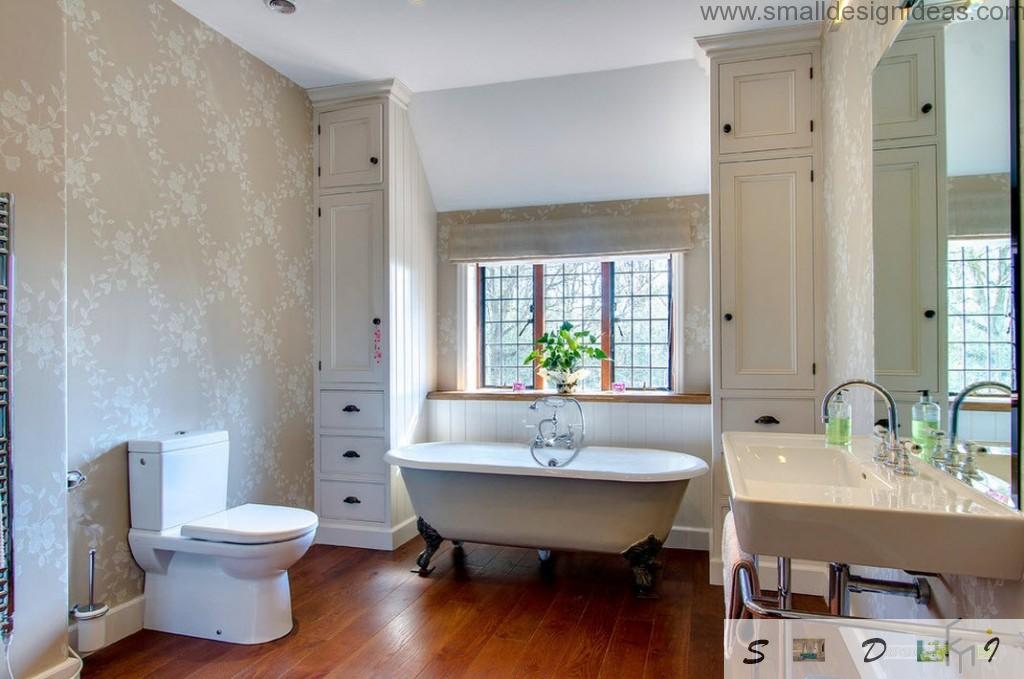 Contrasting wooden floow in white bathroom with classical form of a bathtub