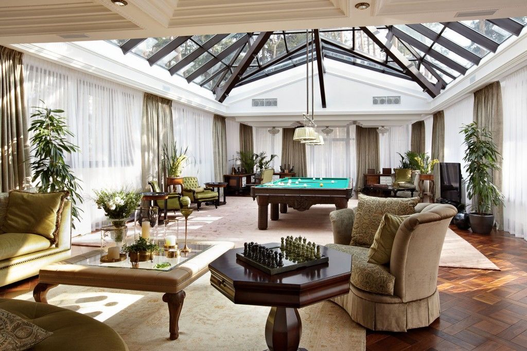 Chic view of the villa with eclecticism of the living room with glass roof