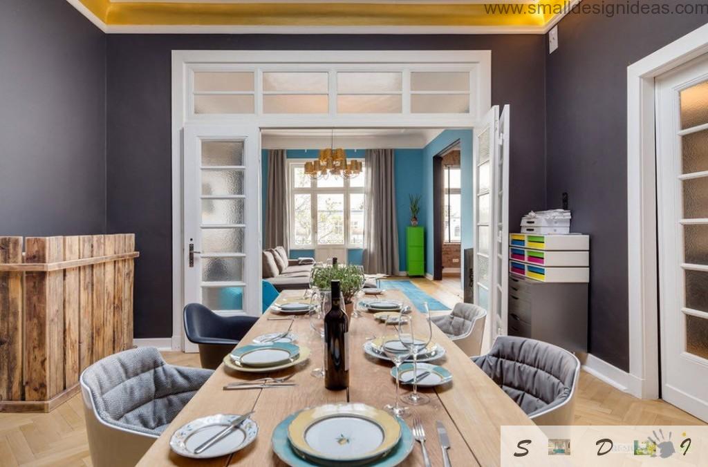 Dining room table with noble wine on the white wooden table in Loft style apartment interior