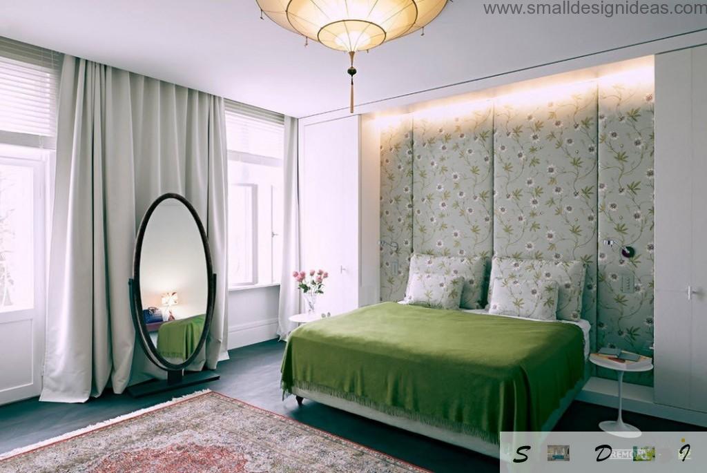 Wall decoration by wallpaper. Mirror and green cover in the bedroom