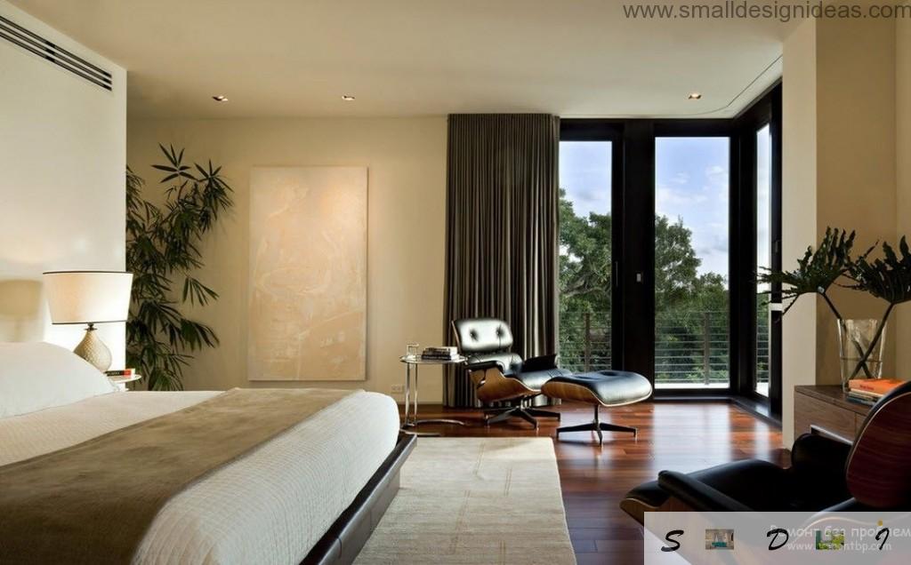 Men`s bedroom in the countryside house in dark and pasel tones with big window and dark curtains