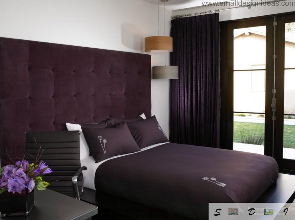 Dark bedroom with purple color accents looks royal and chic