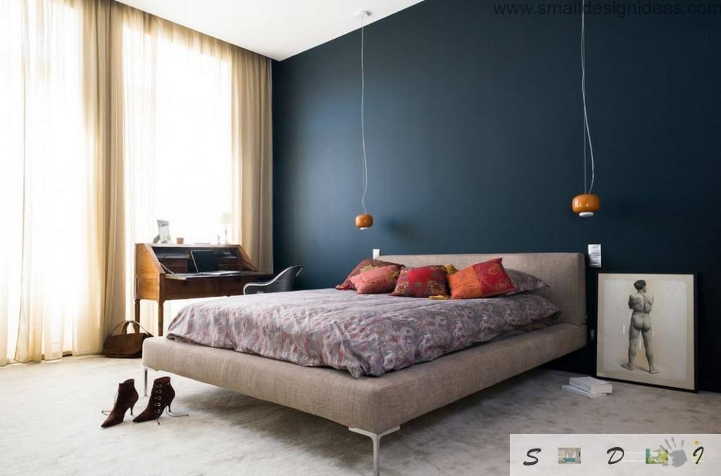 Darl acceте wall in the modern bedroom and a lot of decorative elements