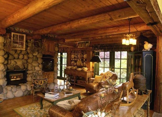 Open ceiling beams and stone cladding for Rustic interior