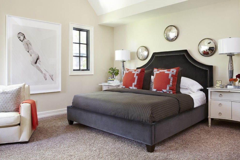 Discreet women`s bedroom with contrasting bed color