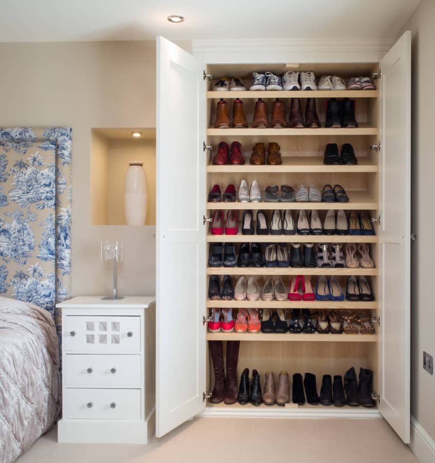 Large cabinet for footwear in casual styled womens bedroom