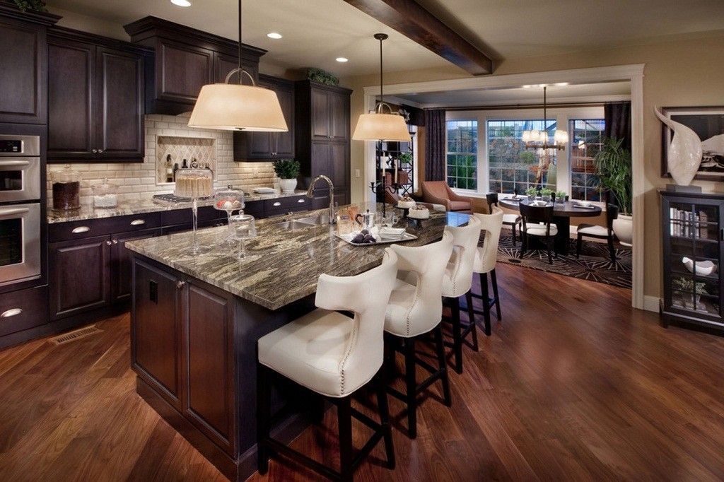 Mediterranean Interior Design Style. Dark kitchen design with broad dining zone