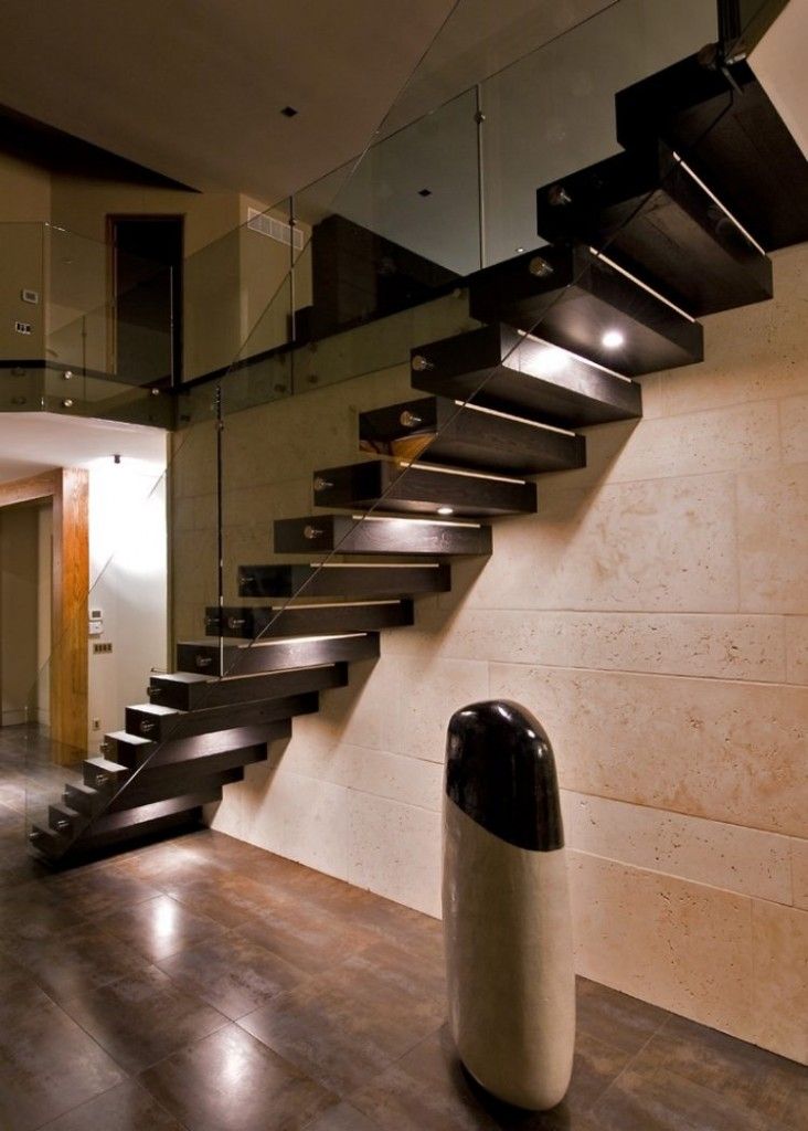 Staircase Modern Constructions Types Design. Lamost lofty construction built in the wall and based on rail stringer with glass handrails