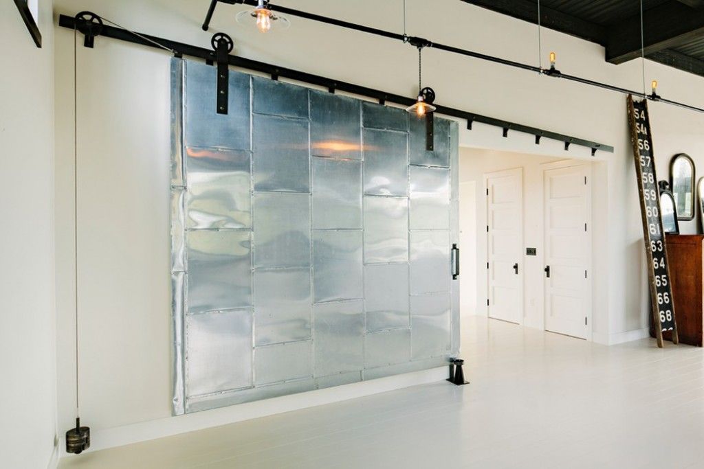 sliding doors interior design ideas. Huge folding loft style gates in the large apartment