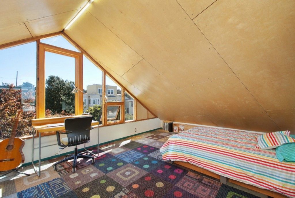 Sloped ceiling in the modern apartment ditracts from the other succesful design solutions which made harmonious interior