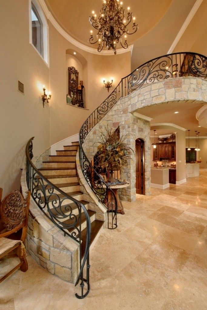 Staircase Modern Constructions Types Design. Royal curved concrete made stairway with wrought iron handrails and decorativу granite finishing of the stringer