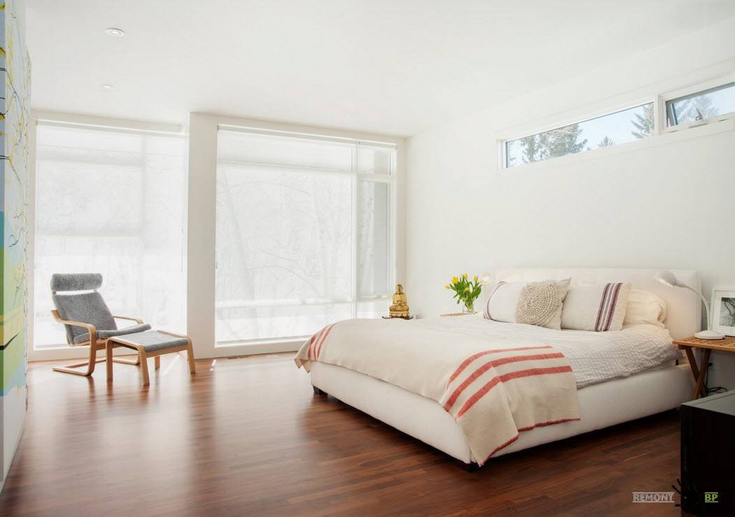Modern Interior Design Laminate Use. Dark flooring and the original window frame in the light designed room
